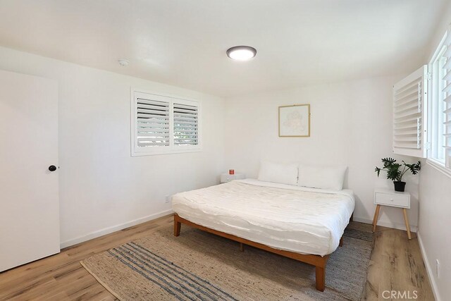 531 W Victoria Ct, Lake Arrowhead, CA 92352 - bedroom with light wood-type flooring and baseboards