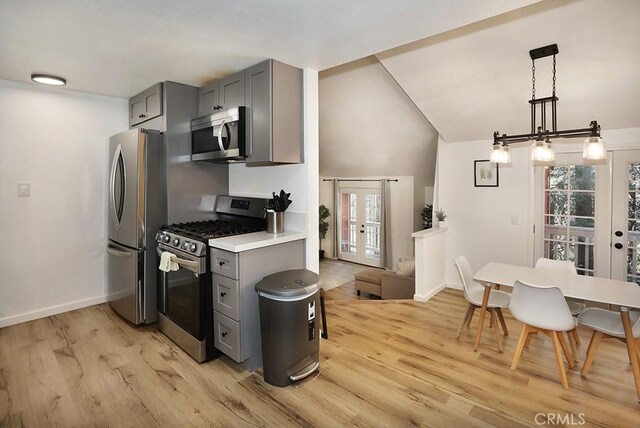 531 W Victoria Ct, Lake Arrowhead, CA 92352 - kitchen with stainless steel appliances, gray cabinetry, french doors, healthy amount of natural light, and lofted ceiling