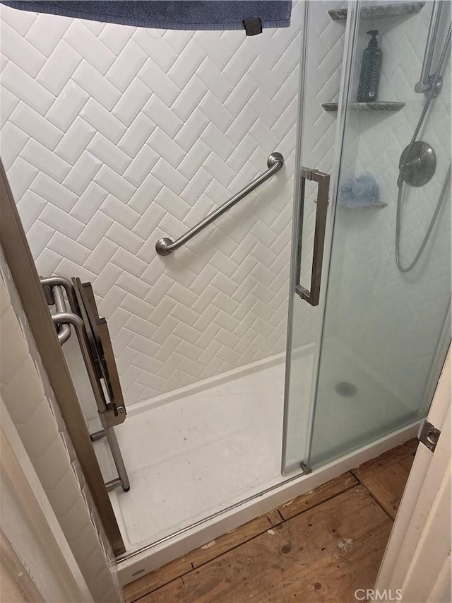 17352 Rob Roy Cir, Huntington Beach, CA 92647 - bathroom featuring a shower stall and wood finished floors