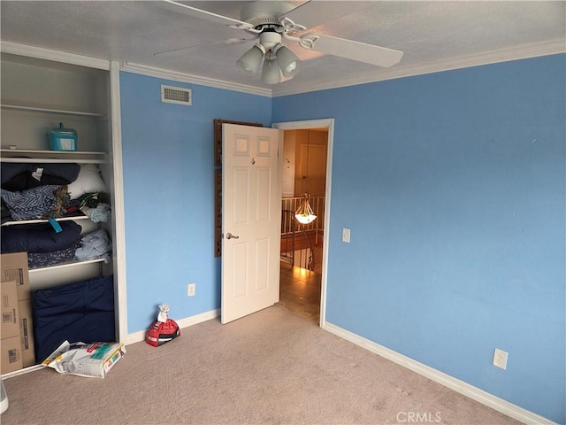 17352 Rob Roy Cir, Huntington Beach, CA 92647 - unfurnished bedroom with crown molding, carpet, baseboards, ceiling fan, and a closet
