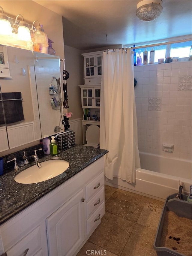 17352 Rob Roy Cir, Huntington Beach, CA 92647 - bathroom with shower / tub combo with curtain, vanity, wainscoting, and tile patterned flooring