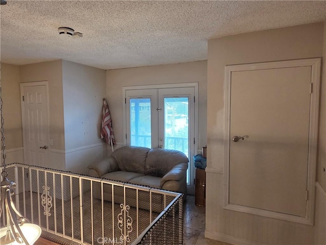17352 Rob Roy Cir, Huntington Beach, CA 92647 - entrance foyer with a textured ceiling and a wainscoted wall