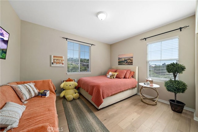 44260 Nighthawk Pass, Temecula, CA 92592 - bedroom featuring light wood-style flooring and baseboards