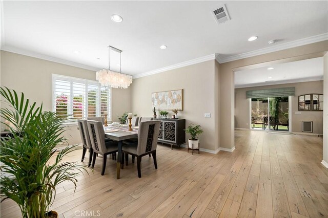 44260 Nighthawk Pass, Temecula, CA 92592 - dining room featuring a chandelier, light wood-style flooring, recessed lighting, baseboards, and ornamental molding