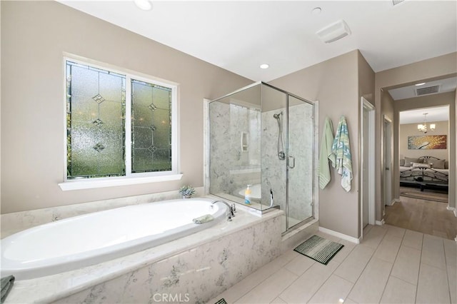 44260 Nighthawk Pass, Temecula, CA 92592 - bathroom featuring a garden tub, connected bathroom, a marble finish shower, and healthy amount of natural light