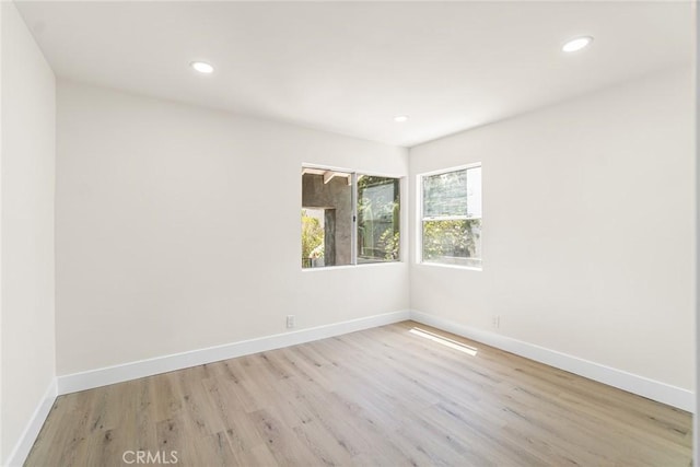 6751 7th Ave, Los Angeles, CA 90043 - empty room featuring light wood-type flooring, baseboards, and recessed lighting