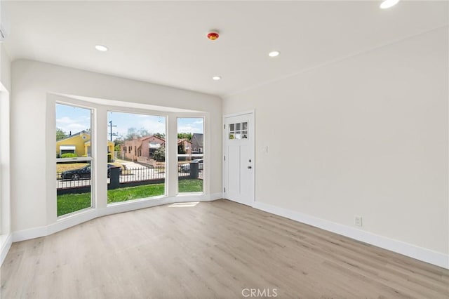 6751 7th Ave, Los Angeles, CA 90043 - empty room with wood finished floors, recessed lighting, and baseboards