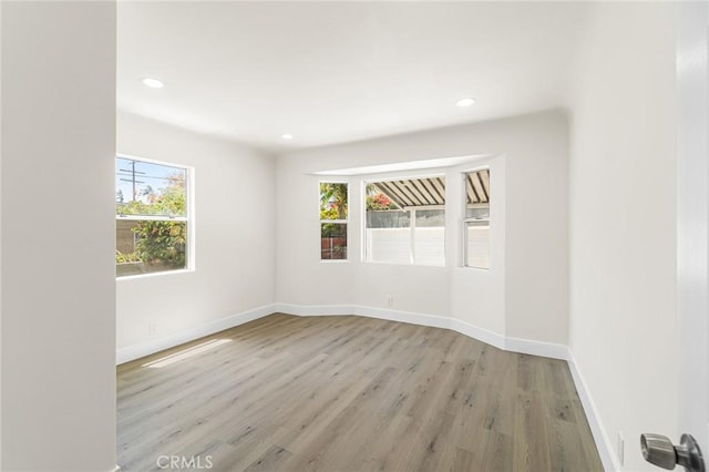 6751 7th Ave, Los Angeles, CA 90043 - empty room featuring light wood-type flooring, baseboards, and recessed lighting