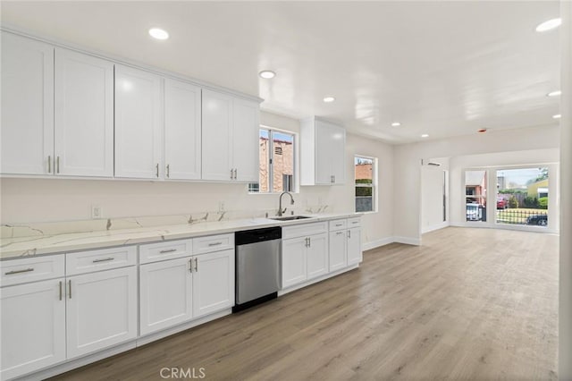 6751 7th Ave, Los Angeles, CA 90043 - kitchen featuring dishwasher, a sink, white cabinetry, light wood finished floors, and baseboards