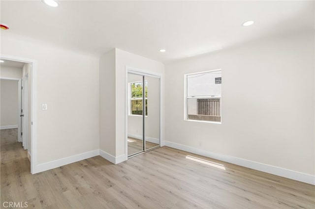 6751 7th Ave, Los Angeles, CA 90043 - unfurnished bedroom with recessed lighting, light wood-type flooring, baseboards, and a closet