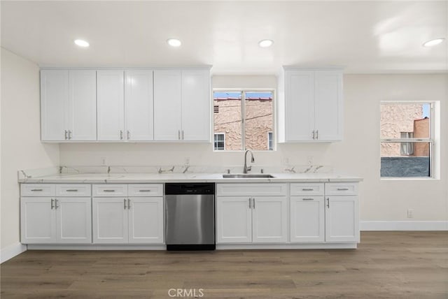 6751 7th Ave, Los Angeles, CA 90043 - kitchen with dishwasher, a sink, white cabinets, baseboards, and light wood-style floors