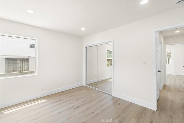6751 7th Ave, Los Angeles, CA 90043 - unfurnished bedroom featuring light wood-style flooring, recessed lighting, a closet, and baseboards