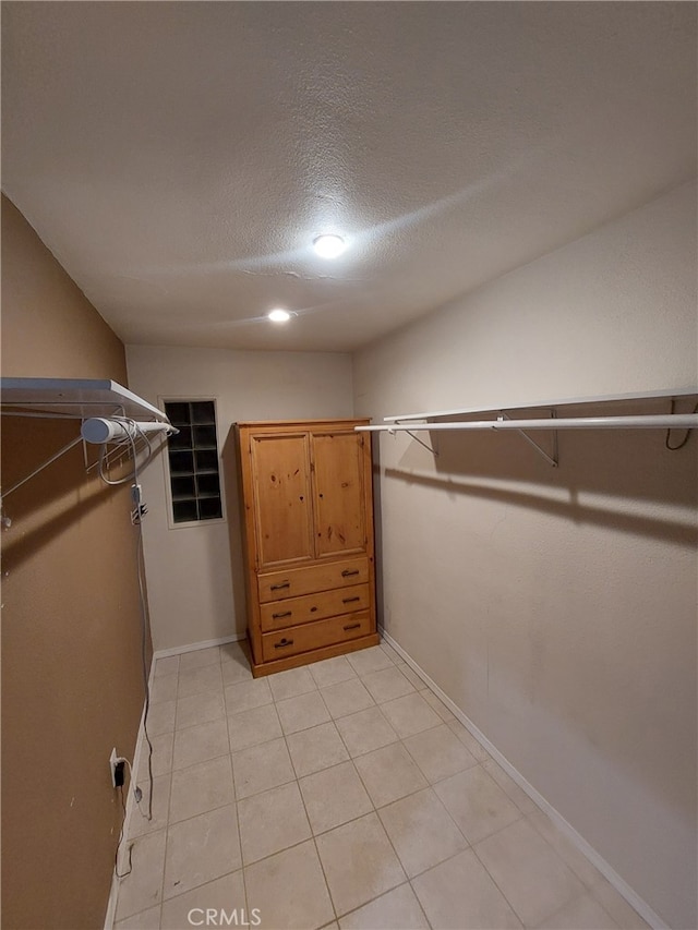 11022 Maple St, Whittier, CA 90601 - spacious closet featuring light tile patterned floors