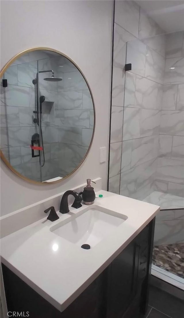 11022 Maple St, Whittier, CA 90601 - full bathroom featuring vanity and a tile shower
