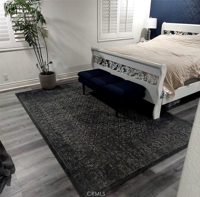 11022 Maple St, Whittier, CA 90601 - bedroom featuring baseboards and wood finished floors