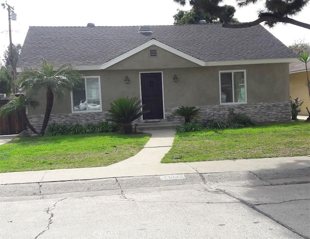 11022 Maple St, Whittier, CA 90601 - ranch-style home with roof with shingles, stucco siding, stone siding, and a front yard