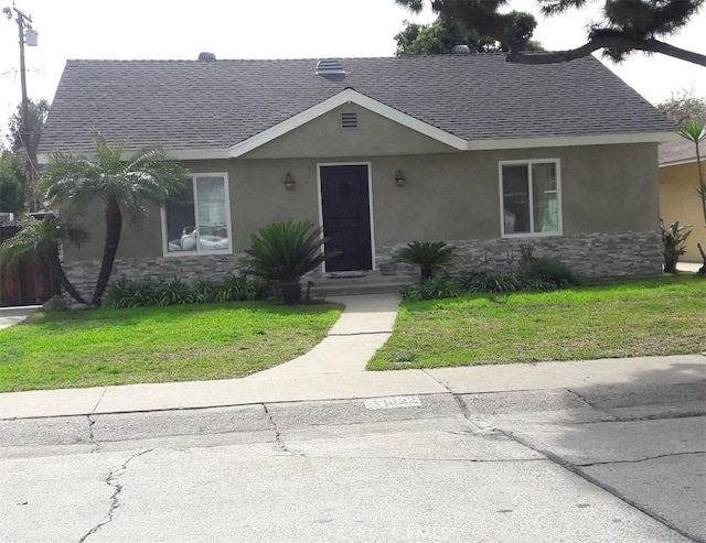 11022 Maple St, Whittier, CA 90601 - ranch-style home featuring a shingled roof, stucco siding, stone siding, and a front yard