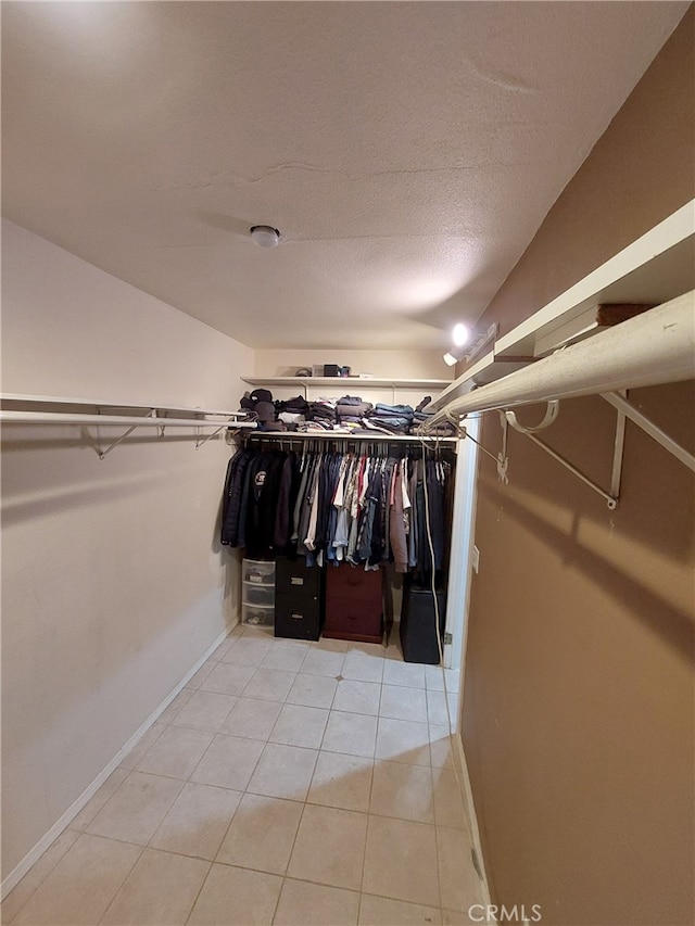11022 Maple St, Whittier, CA 90601 - walk in closet featuring light tile patterned flooring