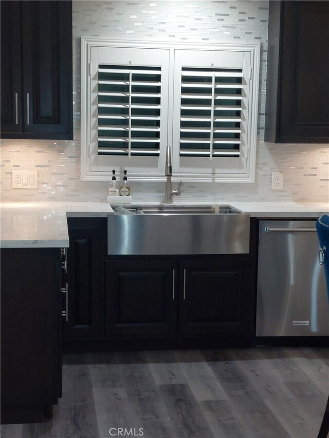 11022 Maple St, Whittier, CA 90601 - kitchen featuring dishwasher, dark cabinetry, and tasteful backsplash