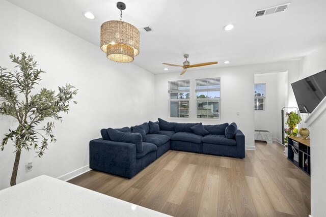 7641 University Ave Unit 105, La Mesa, CA 91942 - living area featuring wood finished floors, baseboards, recessed lighting, a chandelier, and a ceiling fan