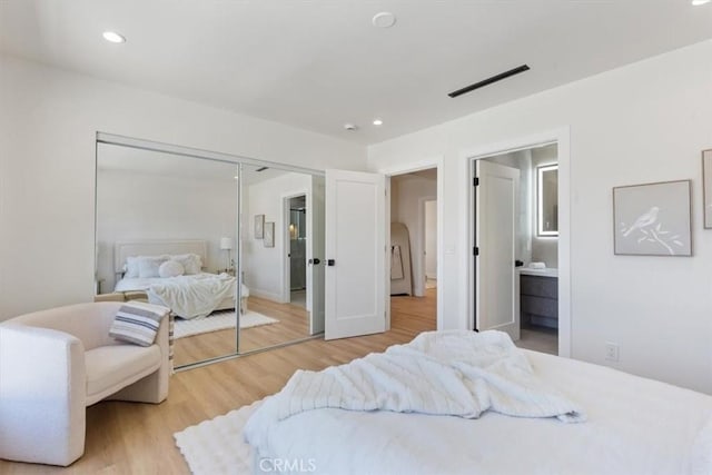 22452 Dolorosa St, Woodland Hills, CA 91367 - bedroom with wood finished floors, a closet, ensuite bath, and recessed lighting