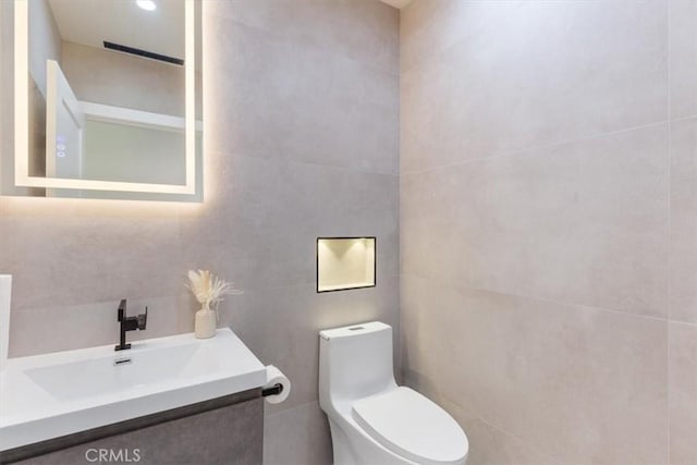 22452 Dolorosa St, Woodland Hills, CA 91367 - bathroom featuring tile walls, toilet, and vanity