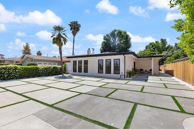 22452 Dolorosa St, Woodland Hills, CA 91367 - back of property featuring a patio, stucco siding, and a chimney