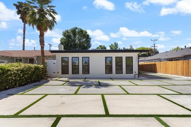 22452 Dolorosa St, Woodland Hills, CA 91367 - back of property featuring a patio area and stucco siding