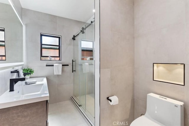 22452 Dolorosa St, Woodland Hills, CA 91367 - bathroom featuring a shower stall, toilet, double vanity, tile walls, and a baseboard heating unit