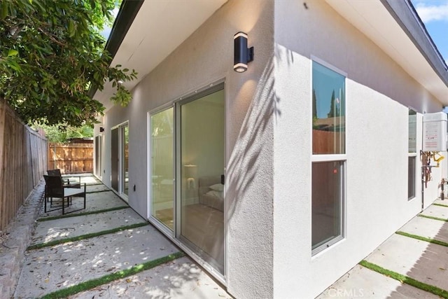 22452 Dolorosa St, Woodland Hills, CA 91367 - view of property exterior featuring stucco siding and a patio area