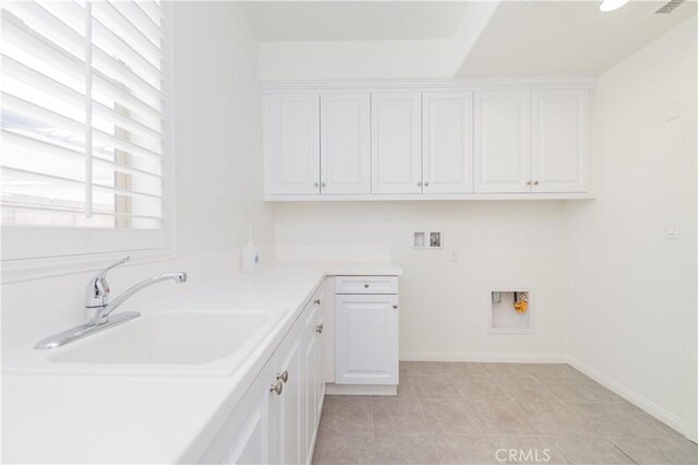 3407 Paseo Dr, Brea, CA 92823 - laundry room featuring hookup for a washing machine, cabinet space, light tile patterned floors, and baseboards