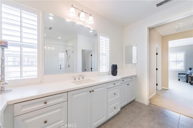 3407 Paseo Dr, Brea, CA 92823 - bathroom with vanity, a stall shower, baseboards, and tile patterned flooring