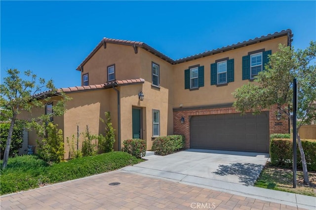 3407 Paseo Dr, Brea, CA 92823 - mediterranean / spanish-style home with an attached garage, stucco siding, a tiled roof, and driveway