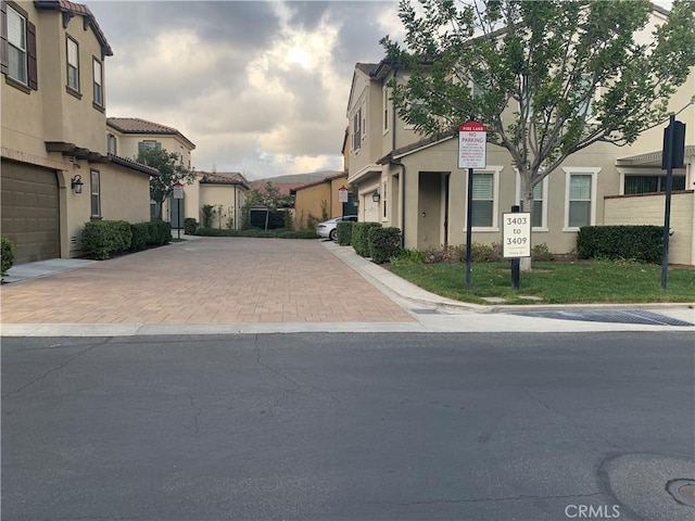 3407 Paseo Dr, Brea, CA 92823 - view of asphalt road with traffic signs and a residential view