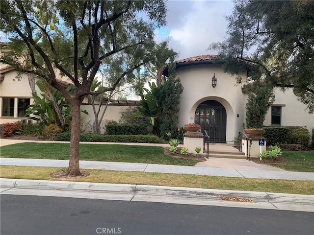 3407 Paseo Dr, Brea, CA 92823 - mediterranean / spanish house with stucco siding, a front lawn, and a tiled roof