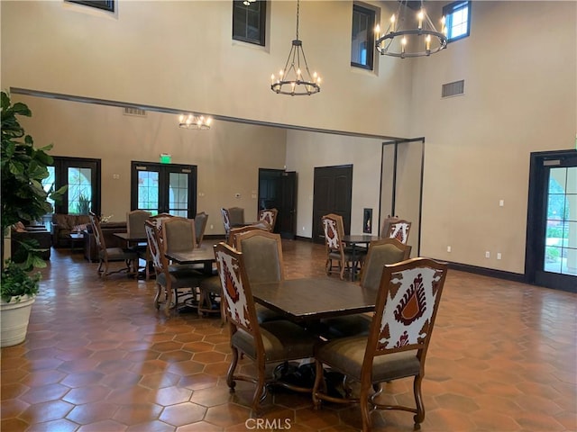 3407 Paseo Dr, Brea, CA 92823 - dining room featuring a chandelier, a towering ceiling, and french doors