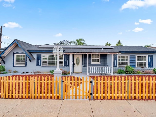 1562 Richandave Ave, El Cajon, CA 92019 - ranch-style house with covered porch, a fenced front yard, roof mounted solar panels, stucco siding, and a gate