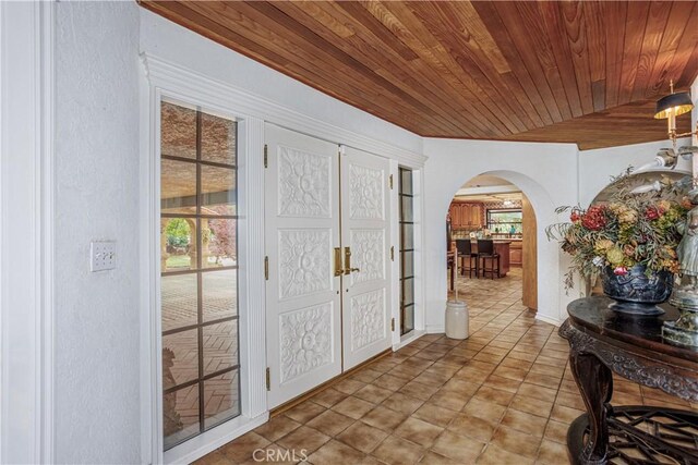 350 Roughrider Rd, La Verne, CA 91750 - foyer entrance with arched walkways, wooden ceiling, and tile patterned floors