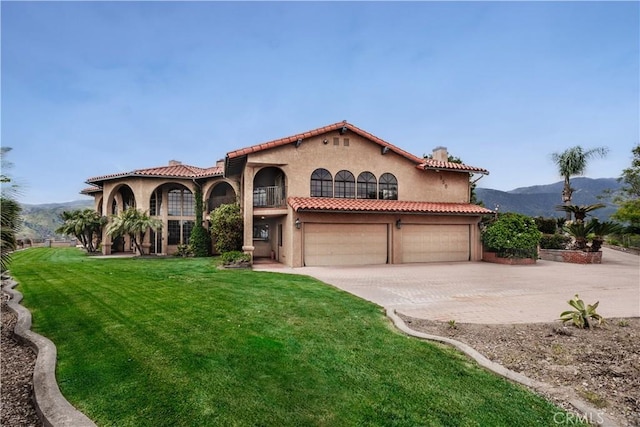 350 Roughrider Rd, La Verne, CA 91750 - mediterranean / spanish-style house with an attached garage, stucco siding, driveway, and a front yard