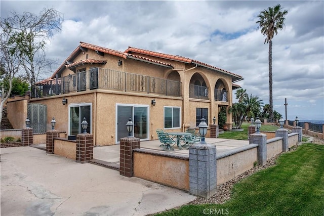 350 Roughrider Rd, La Verne, CA 91750 - back of property featuring a balcony, a patio area, a tiled roof, and stucco siding
