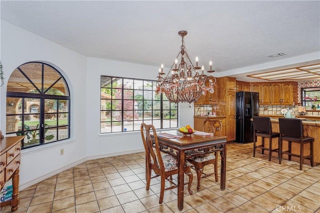 350 Roughrider Rd, La Verne, CA 91750 - dining room with a chandelier, light tile patterned floors, and baseboards