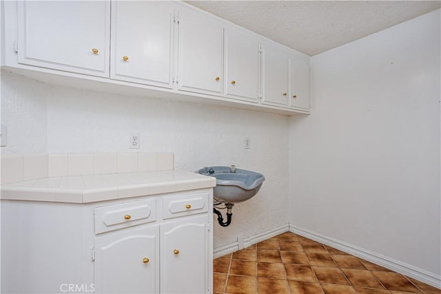 350 Roughrider Rd, La Verne, CA 91750 - laundry area featuring baseboards and a textured ceiling