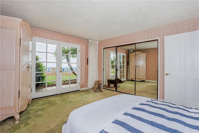 350 Roughrider Rd, La Verne, CA 91750 - bedroom with french doors, carpet floors, a textured ceiling, multiple windows, and wallpapered walls