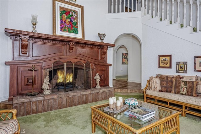 350 Roughrider Rd, La Verne, CA 91750 - living area featuring carpet floors, arched walkways, and a fireplace