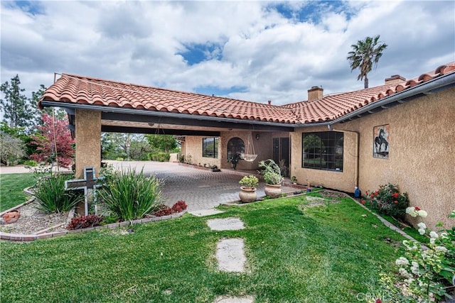 350 Roughrider Rd, La Verne, CA 91750 - view of front of home featuring a patio, a front lawn, a chimney, stucco siding, and a carport