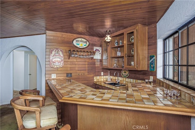 350 Roughrider Rd, La Verne, CA 91750 - indoor wet bar featuring wooden ceiling, wooden walls, arched walkways, and decorative light fixtures