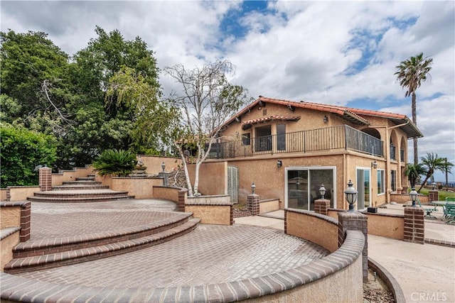 350 Roughrider Rd, La Verne, CA 91750 - rear view of house featuring a balcony, a patio, and stucco siding