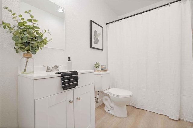 1025 4th Ave Unit 8, Chula Vista, CA 91911 - full bathroom with wood finished floors, toilet, and vanity