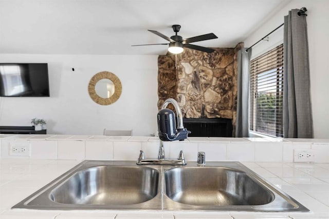 1025 4th Ave Unit 8, Chula Vista, CA 91911 - detailed view of tile counters, a sink, and a ceiling fan