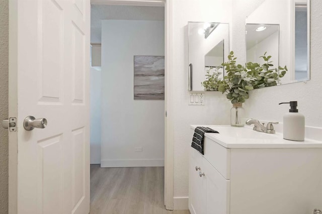 1025 4th Ave Unit 8, Chula Vista, CA 91911 - bathroom with wood finished floors, vanity, and baseboards